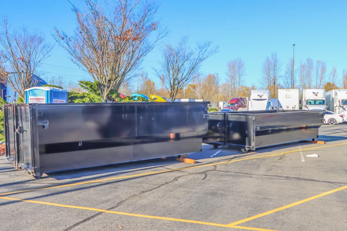 Professional dumpster rental service with roll-off container on residential driveway in Youngstown